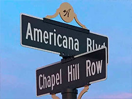 decorative street signs with finials and logo