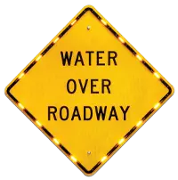 water over roadway sign